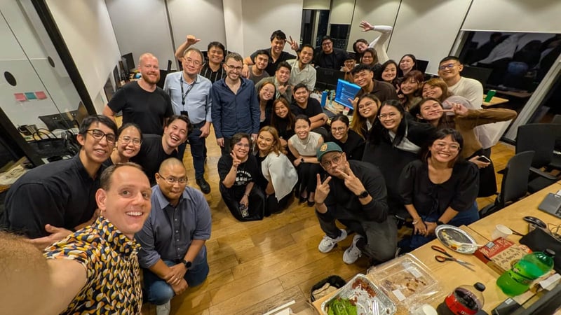 Leadership team with the Philippines team for a casual pizza gathering.